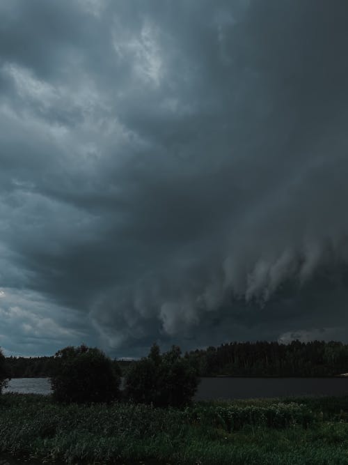 Dramatic Sky with Gray Storm Clouds over the Lake