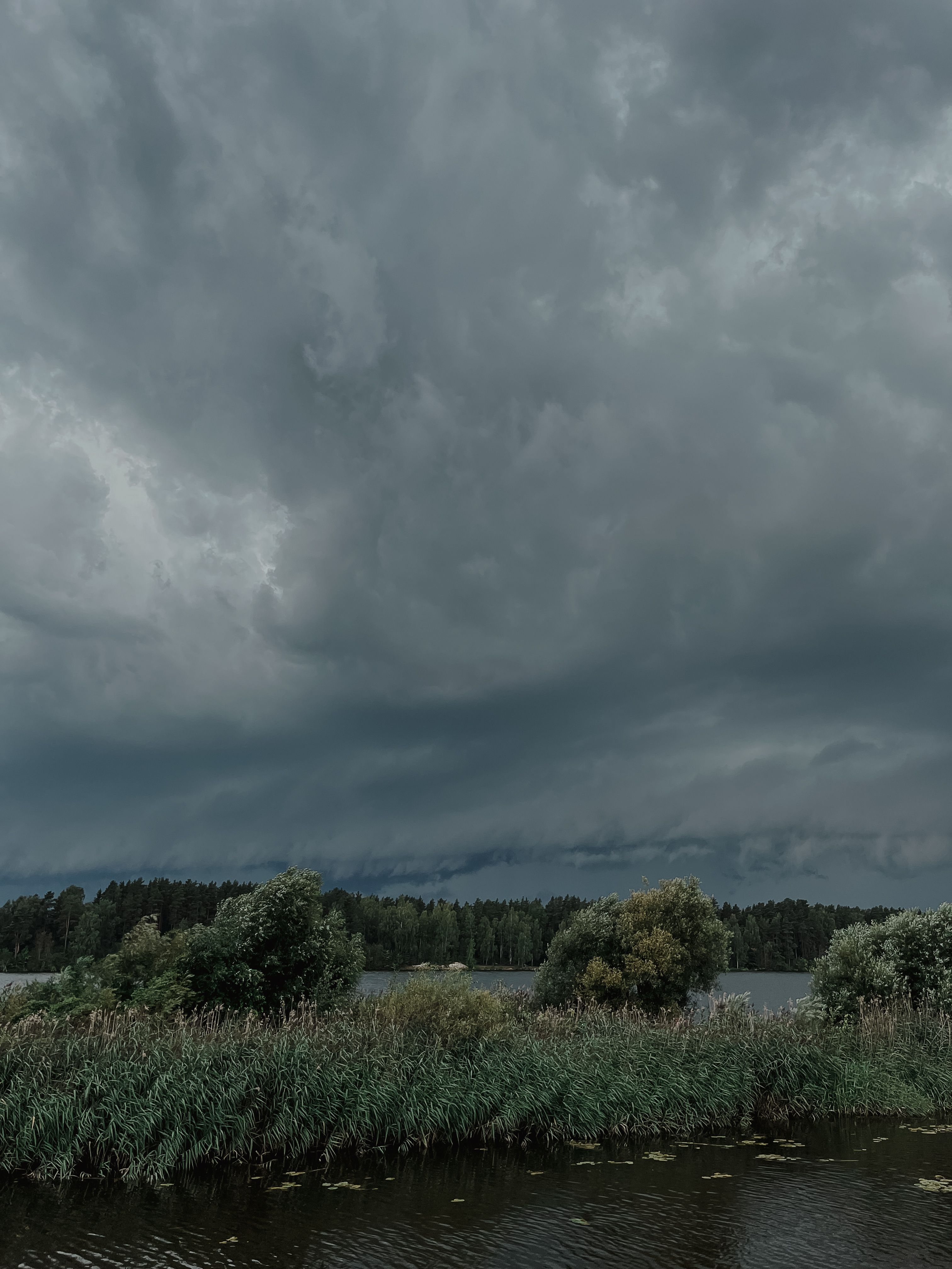 Dramatic Sky with Gray Storm Clouds over the Lake · Free Stock Photo