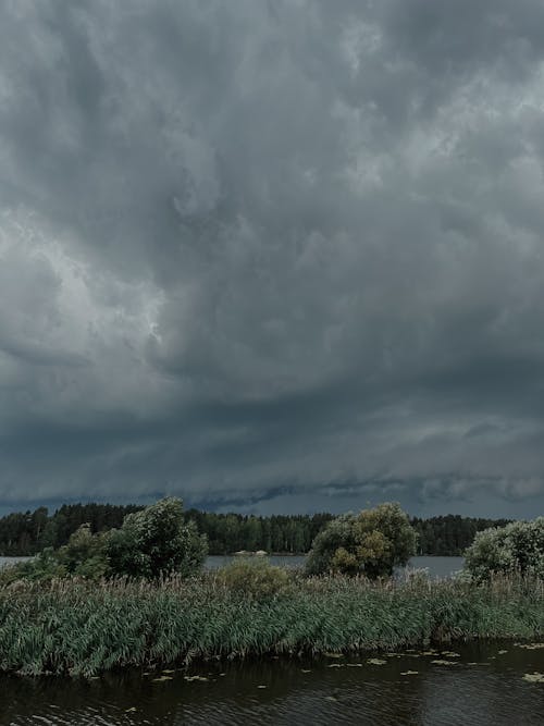 Dramatic Sky with Gray Storm Clouds over the Lake