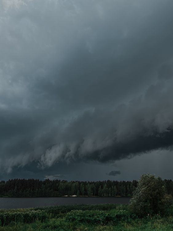 Dramatic Sky with Gray Storm Clouds over the Lake · Free Stock Photo