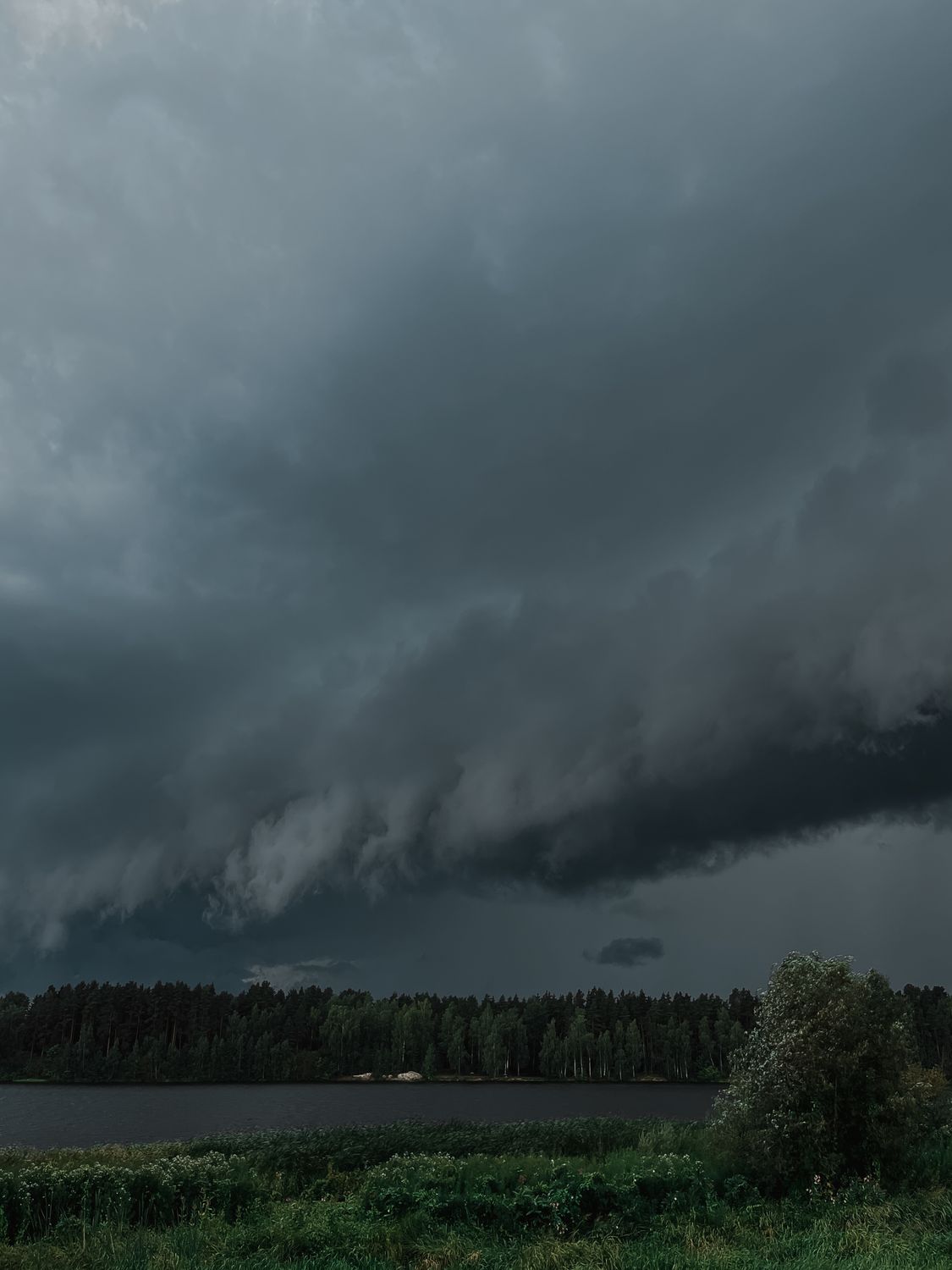Dramatic Sky with Gray Storm Clouds over the Lake · Free Stock Photo