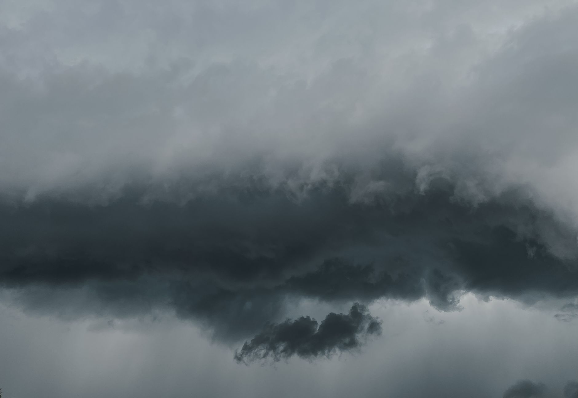 A striking capture of dramatic storm clouds gathering, showcasing nature's fury.. striking, capture, dramatic