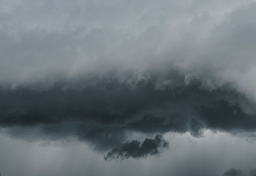 A striking capture of dramatic storm clouds gathering, showcasing nature's fury.. striking, capture, dramatic