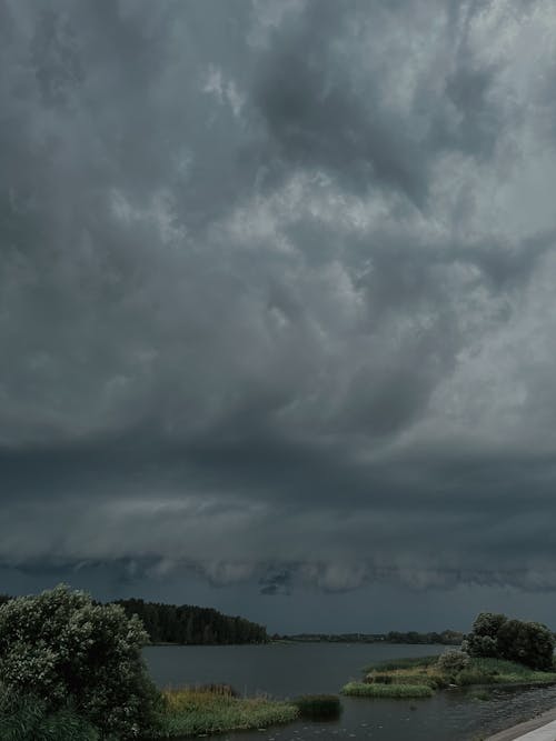 Dramatic Sky with Gray Storm Clouds over the Lake