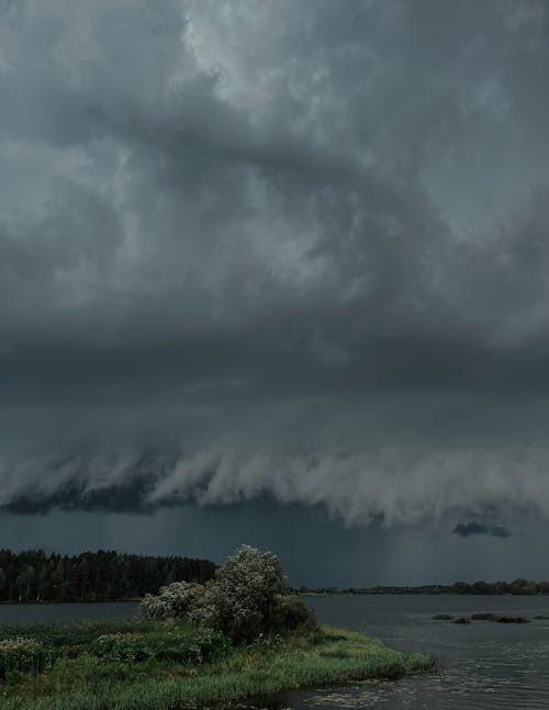 Dramatic Sky with Gray Storm Clouds over the Lake