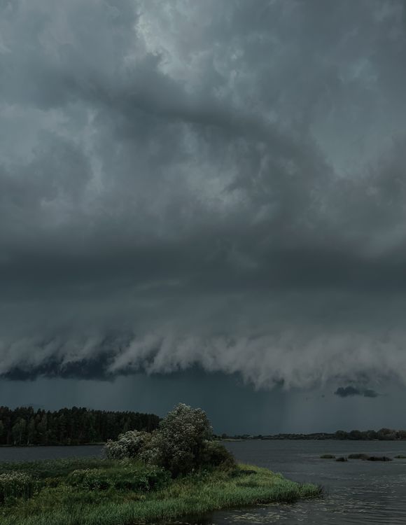 Dramatic Sky with Gray Storm Clouds over the Lake · Free Stock Photo