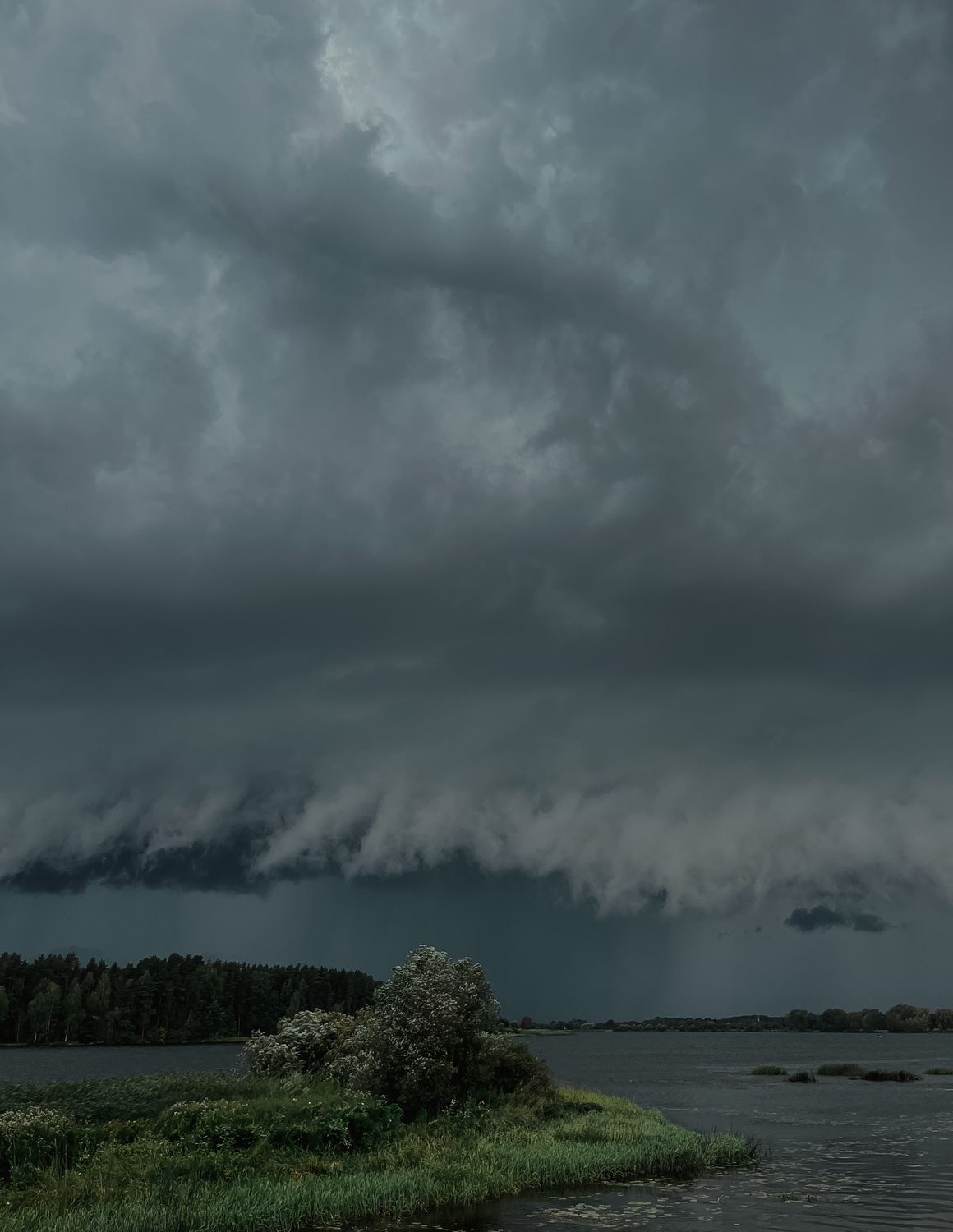 Dramatic Sky with Gray Storm Clouds over the Lake · Free Stock Photo