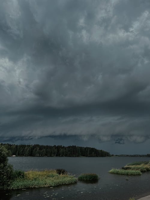 Dramatic Sky with Gray Storm Clouds over the Lake