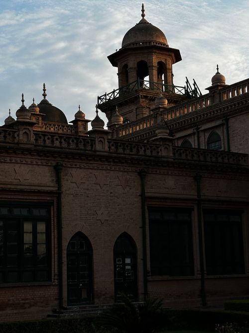 Free Capture of Islamia College's stunning facade and dome in Peshawar at dusk. Stock Photo