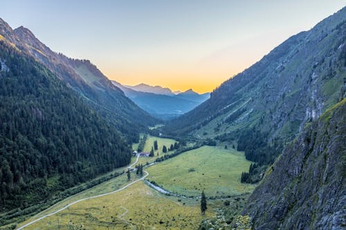 Mountain Landscape with a Green Field in a Valley