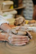 Hands shaping clay — photo by Elizabeth Gartside on Pexels