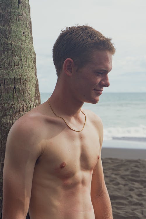 Topless Man on Beach