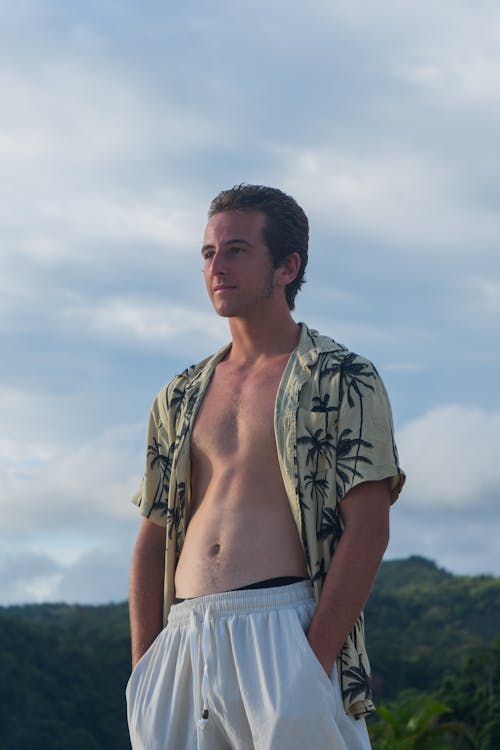 Man in Shirt Standing with Hands in Pockets