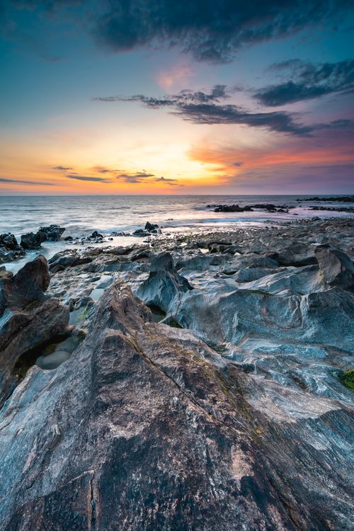 Free Stunning sunset view over the rocky coast of Vila Nova de Gaia, Porto, Portugal. Stock Photo