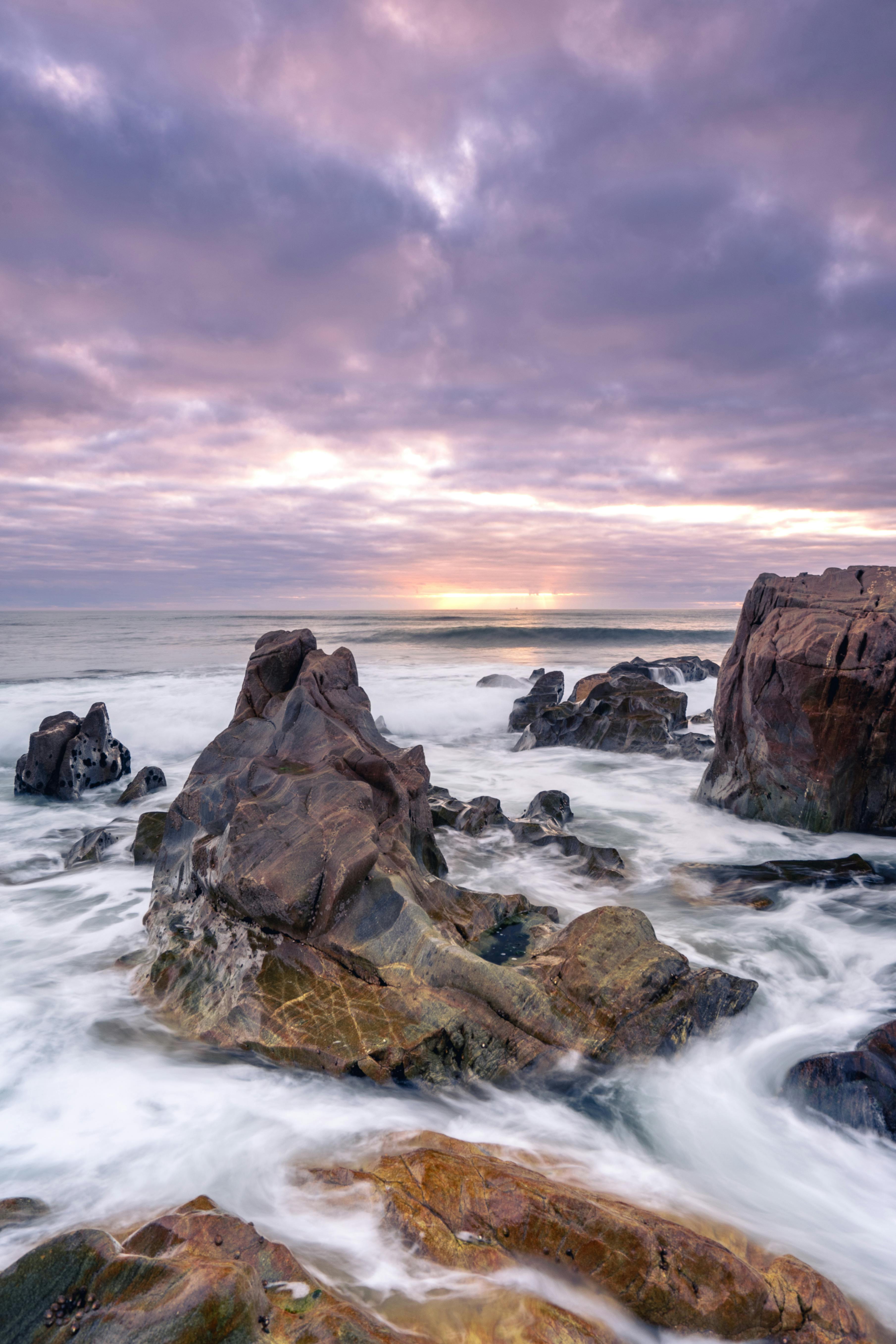 sunset at the rocky beach at vila nova de gaia portugal