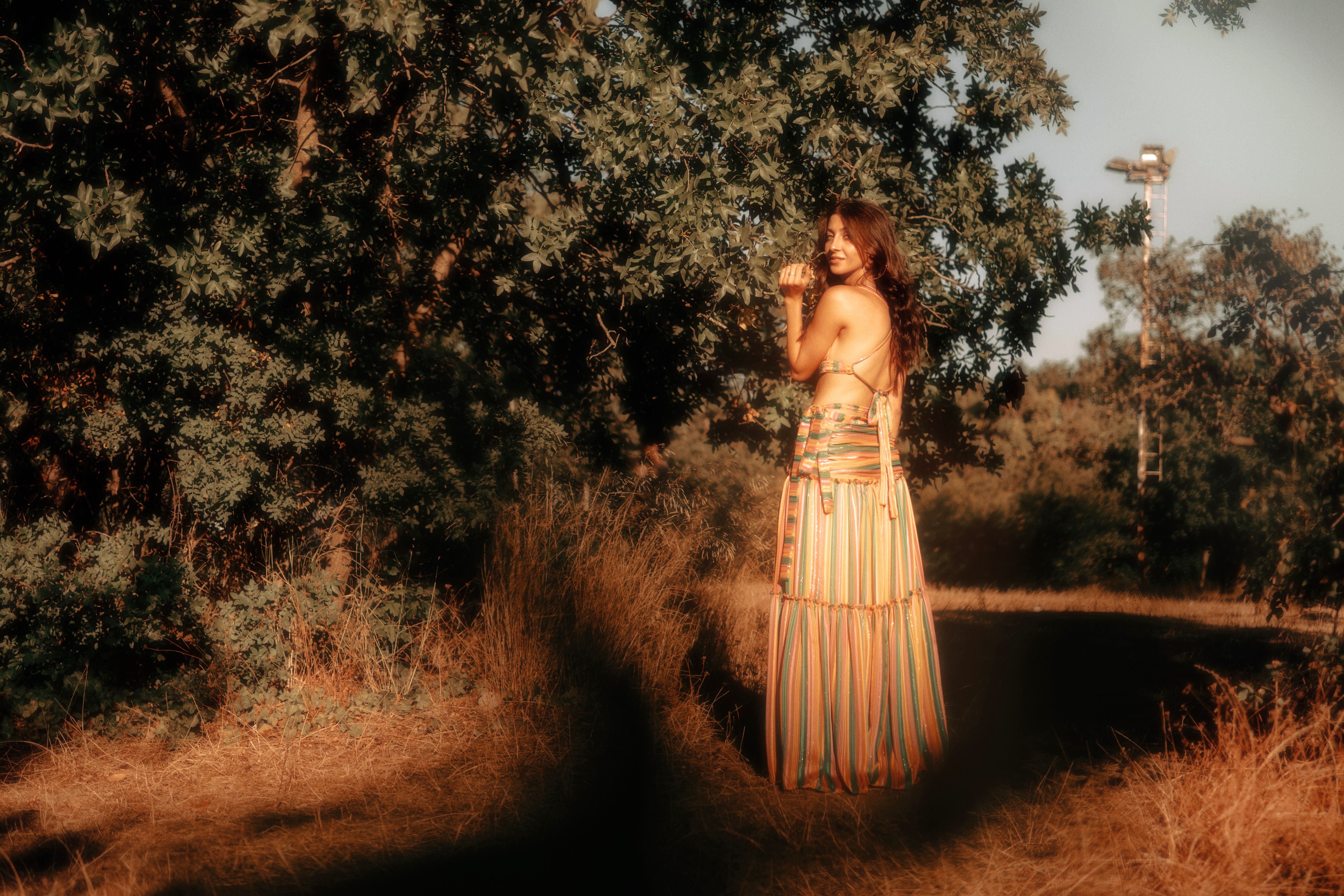 Woman in Dress Posing in Forest on Golden Hour · Free Stock Photo