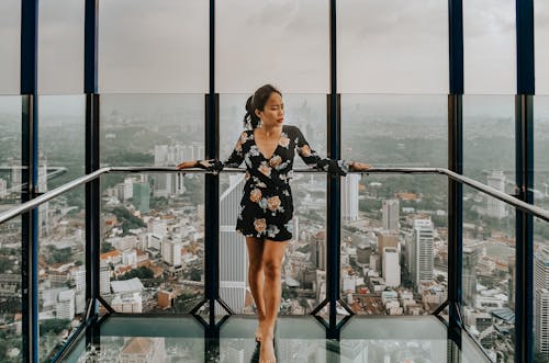 Free Woman Standing Against Railing Stock Photo