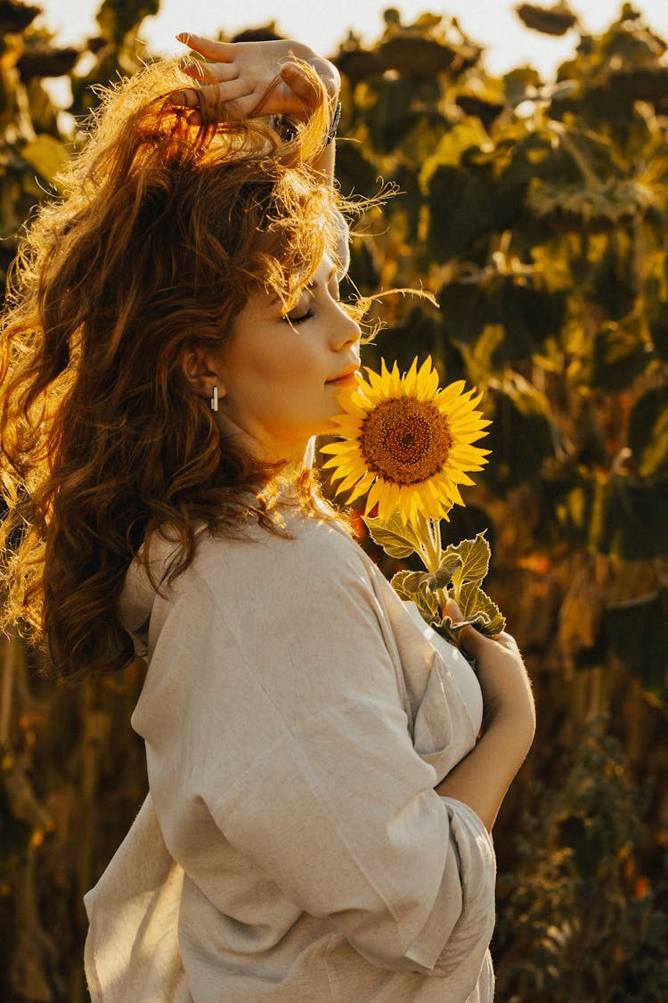 Woman Posing With Sunflower