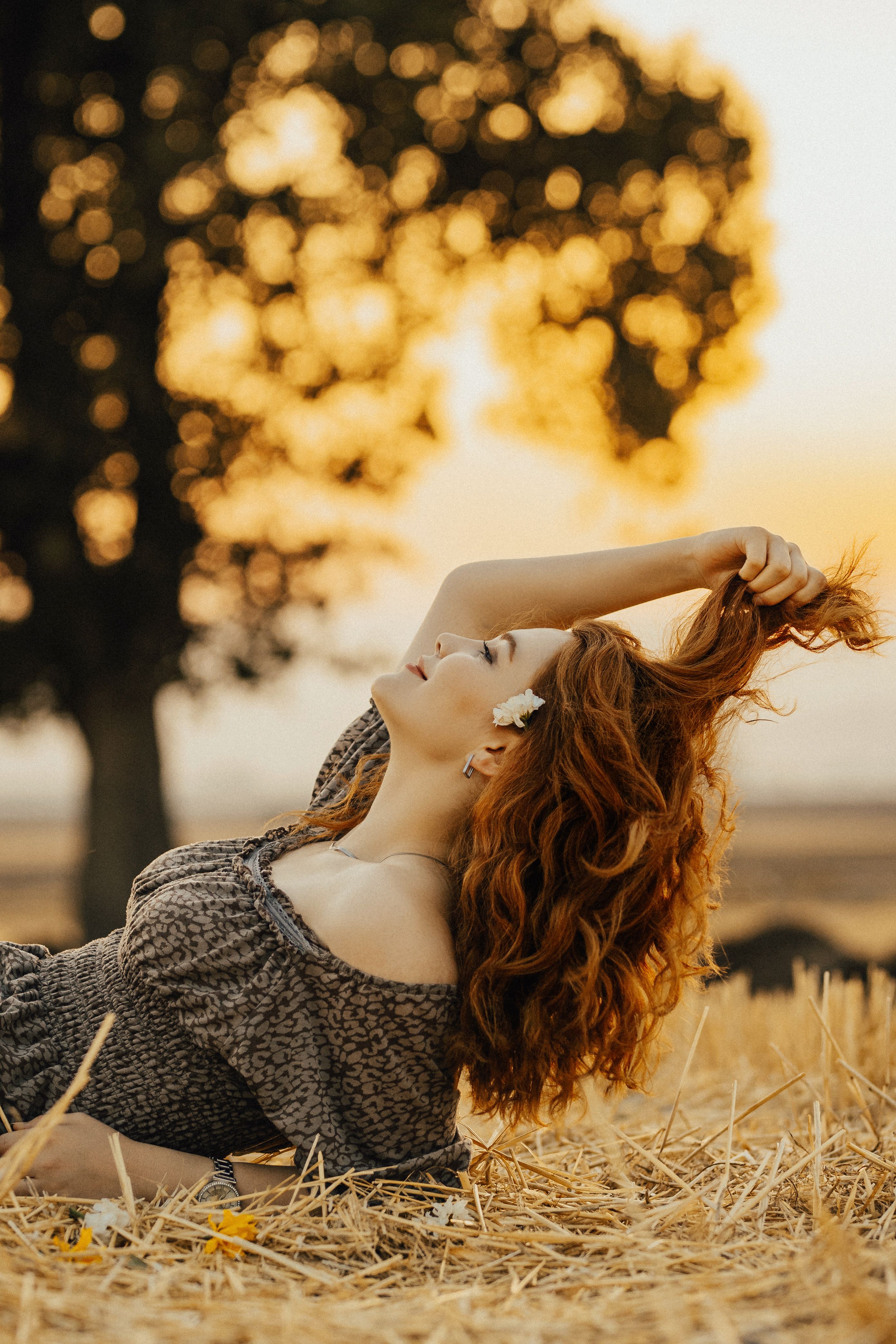 Woman Posing on a Field During Sunset · Free Stock Photo