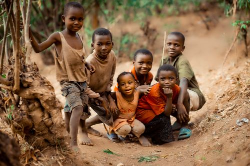 Free Group of smiling children posing together in a rural setting in Bujumbura, Burundi. Stock Photo