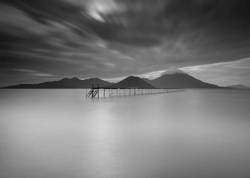 Free Grayscale Photo Of Dock During Cloudy Day Stock Photo