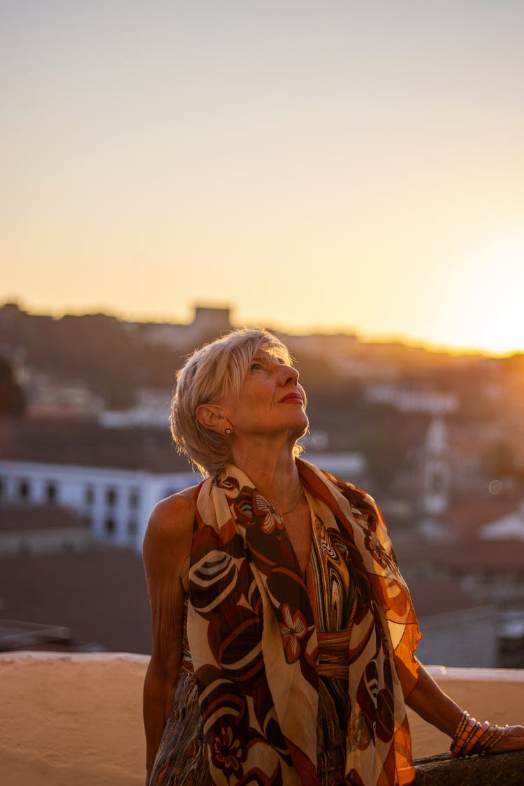 Woman Looking Up At Sunset