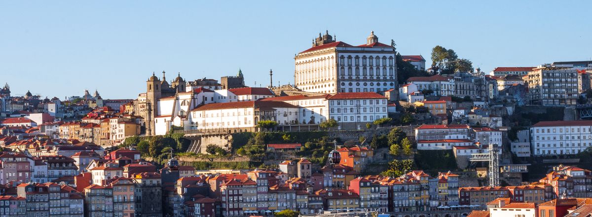 Beautiful aerial view of Porto, Portugal showcasing historic buildings and red rooftops.