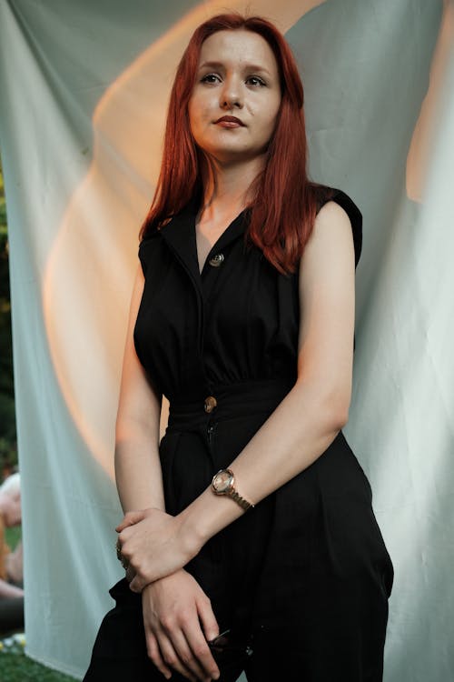 Portrait of Redhead Woman in Black Clothes