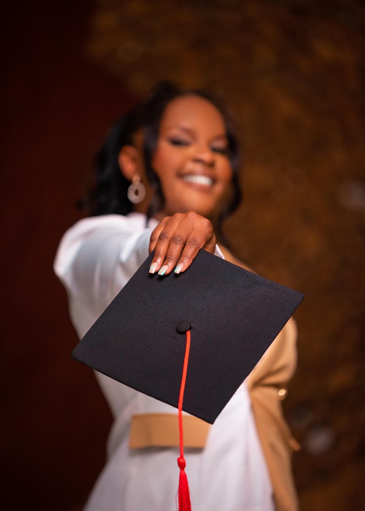 Graduate Holding Academic Hat