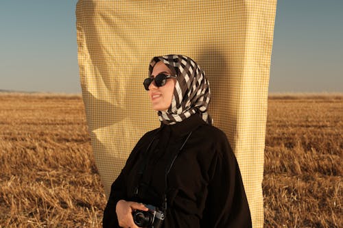 Smiling Woman in Sunglasses and Hijab