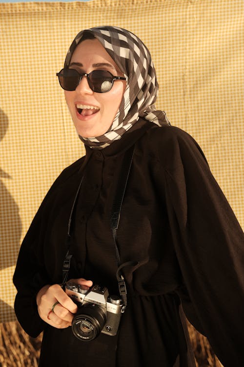 Portrait of Woman in Sunglasses and Hijab