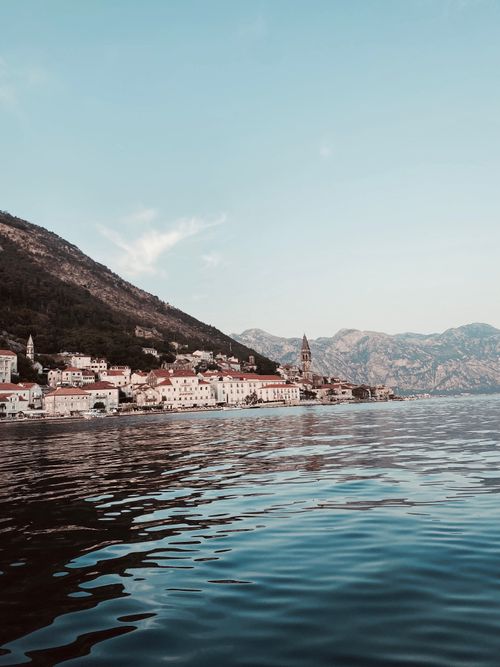 Free Charming seaside town of Perast with picturesque mountains and sea view. Stock Photo
