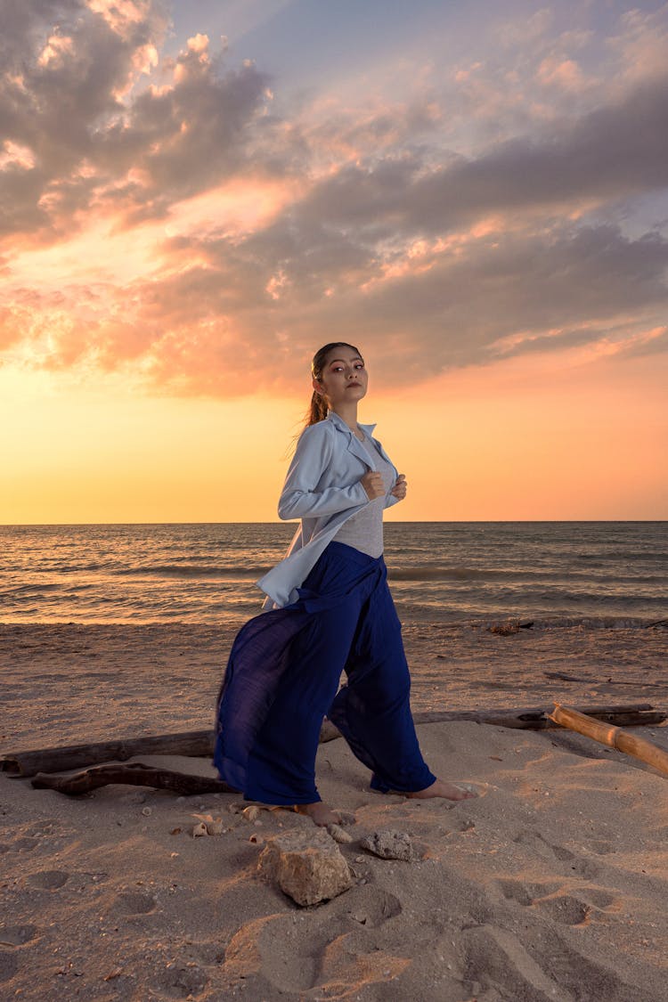 Woman Standing And Posing On Beach