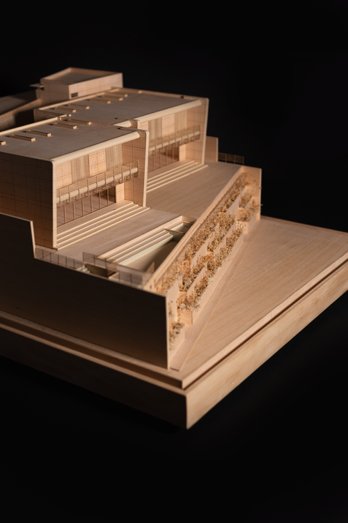 Free Detailed wooden architectural model displayed against a black background. Stock Photo