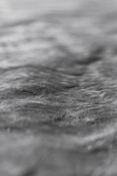 Black and white close-up of waves capturing texture and motion at Aracati Beach.