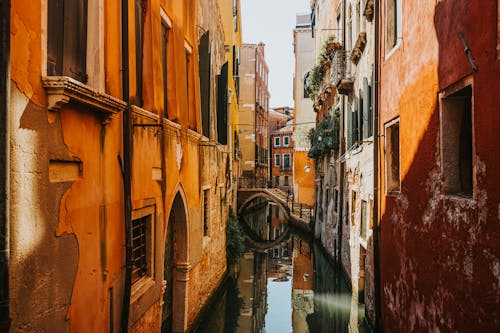 View of the Canal between Traditional Buildings in Venice, Italy 