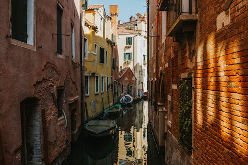 View of the Canal between Traditional Buildings in Venice, Italy 