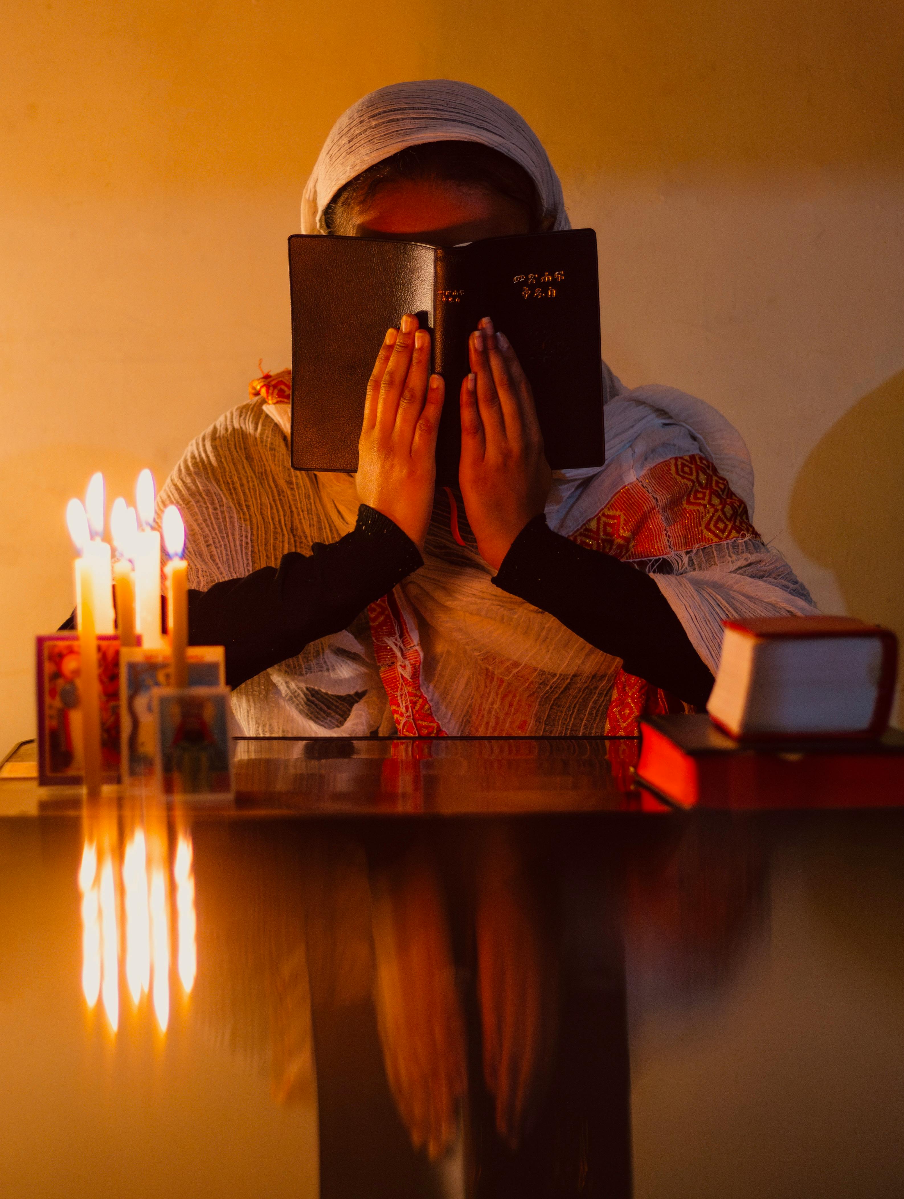 woman-in-white-robes-and-with-candle