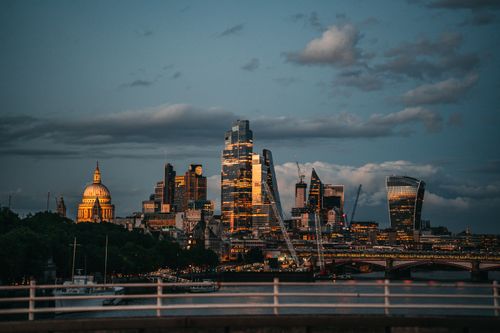 Free Capture of London's skyline at sunset showcasing modern skyscrapers and historic landmarks. Stock Photo
