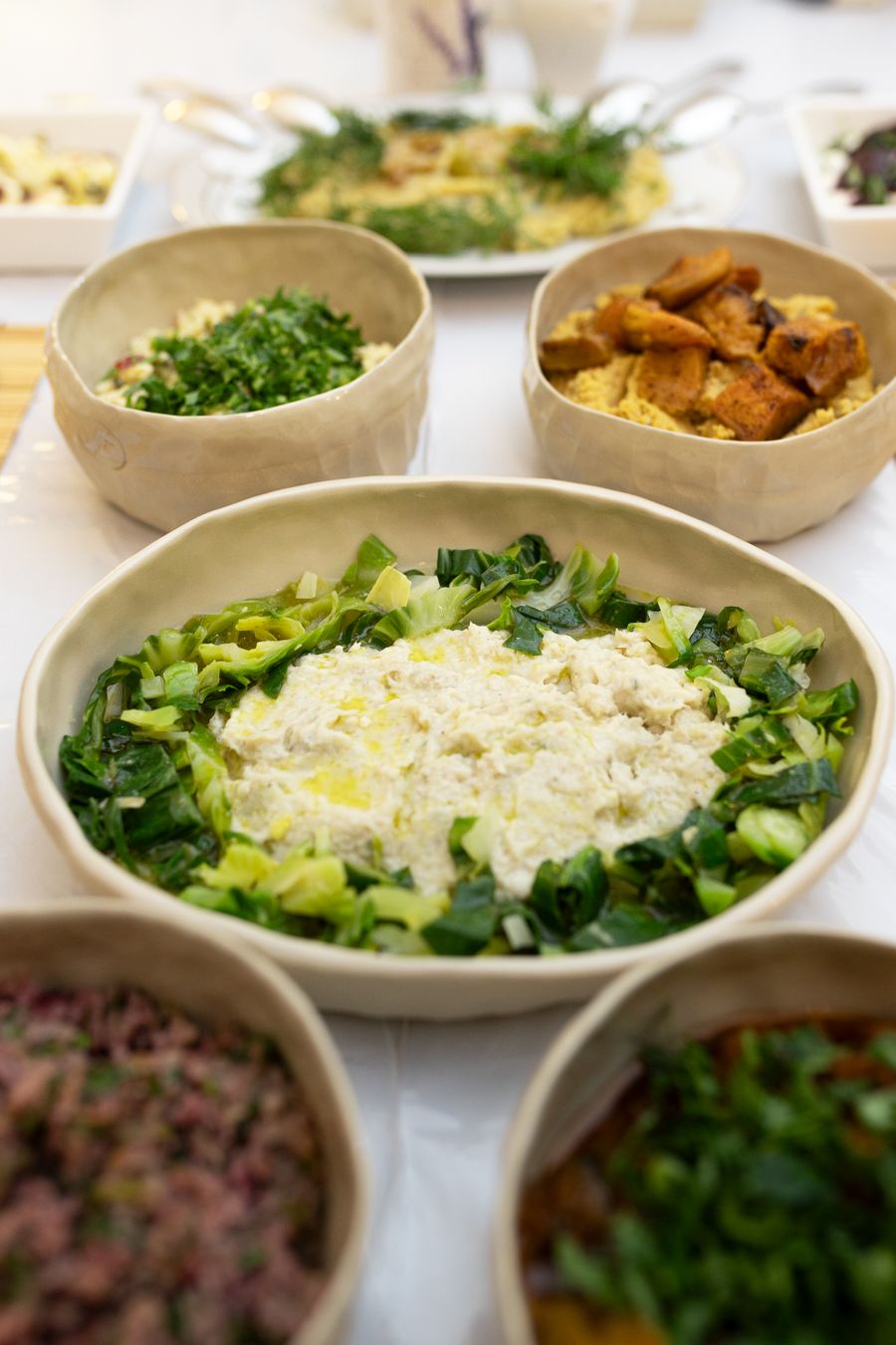 Table of seasonal grain and greens bowls, photo by Vural Yavas on Pexels