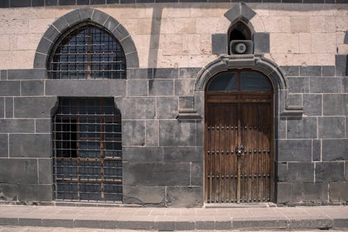 Door and Bars on Building Wall