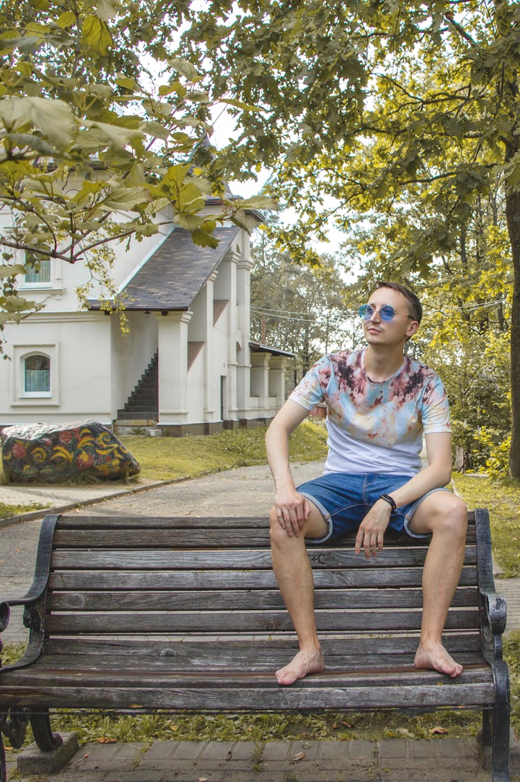 Man In Sunglasses Posing On Bench