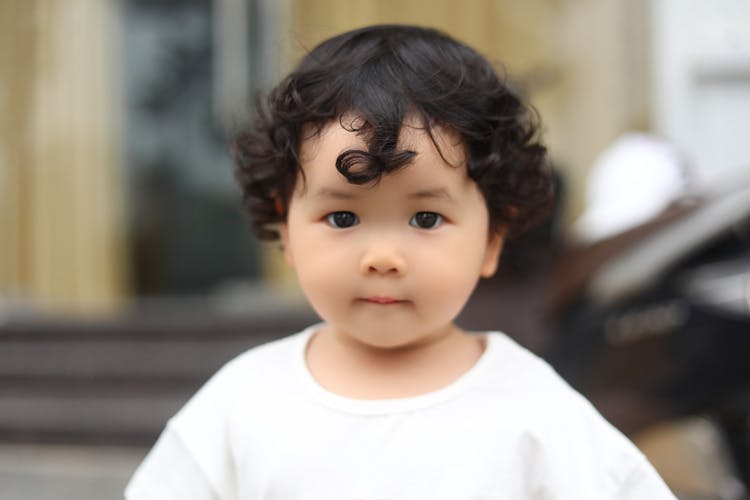 Portrait Of A Baby In A White Blouse 