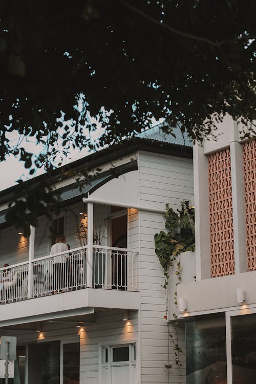 Person on Balcony of White House in Brisbane, Australia