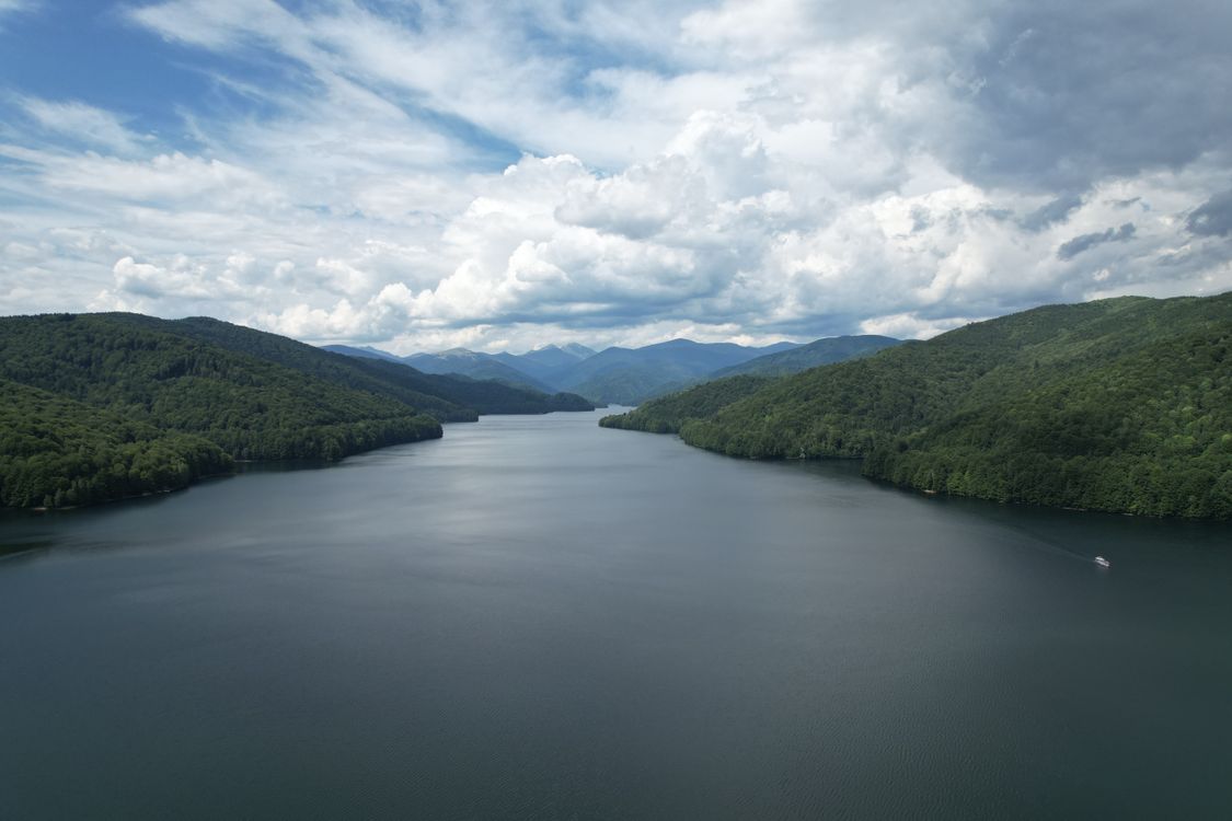 With Rivers Raring Below River under Clouds · Free Stock Photo