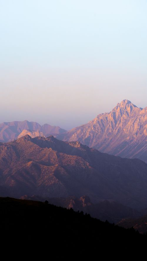 Free Stunning aerial view of Turkey's mountains with soft dawn light casting shadows over the peaks. Stock Photo