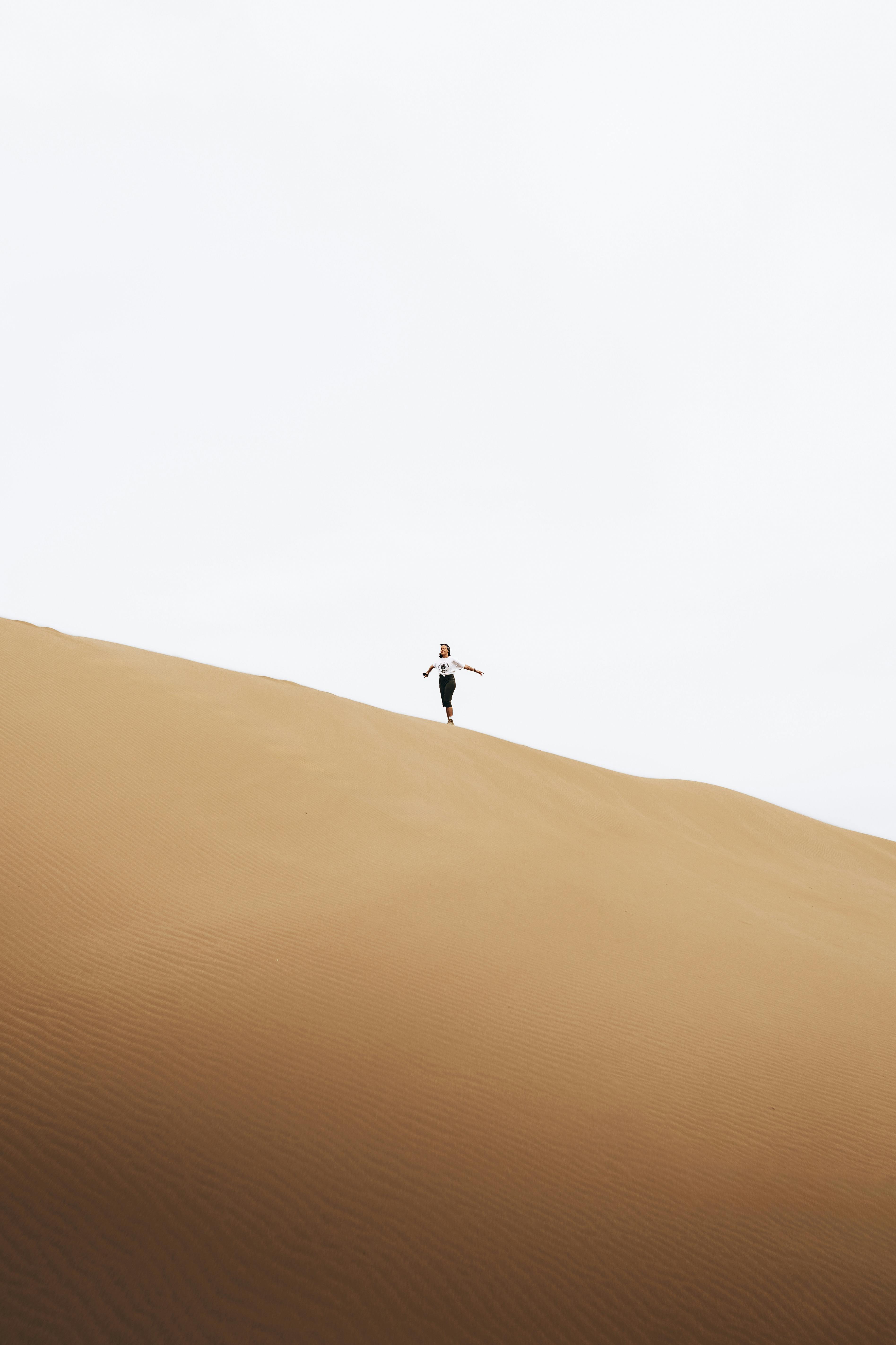 woman on dune on desert
