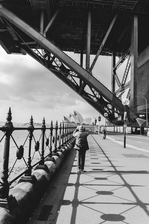 Person Standing in Front of Sydney Harbour Bridge in Australia