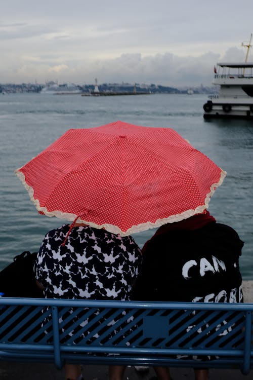 People under Umbrella in Seaside