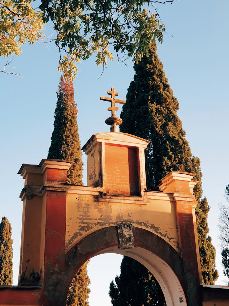 Trees And Orthodox Cross On Gate